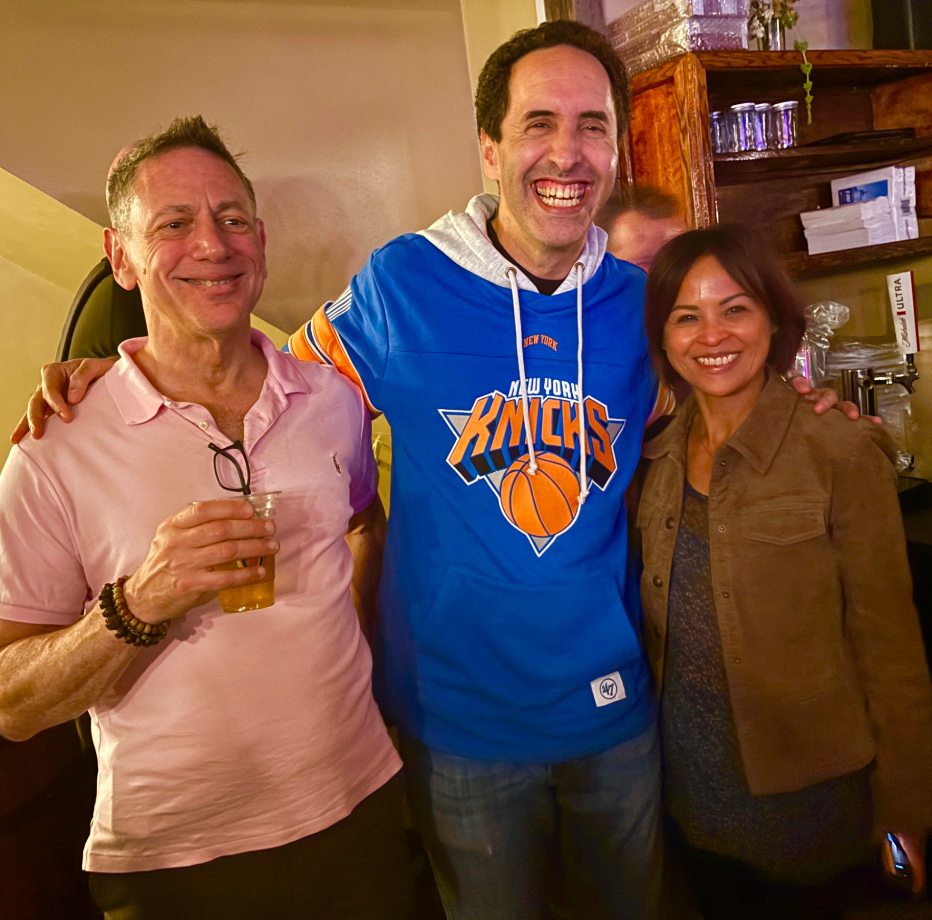 David Berkowitz in a New York Knicks jersey, celebrating with friends
